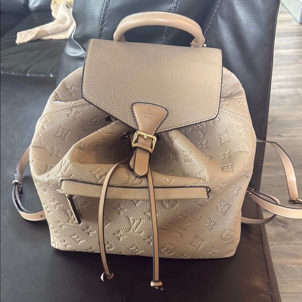 Louis Vuitton Cream Backpack with Iconic Design